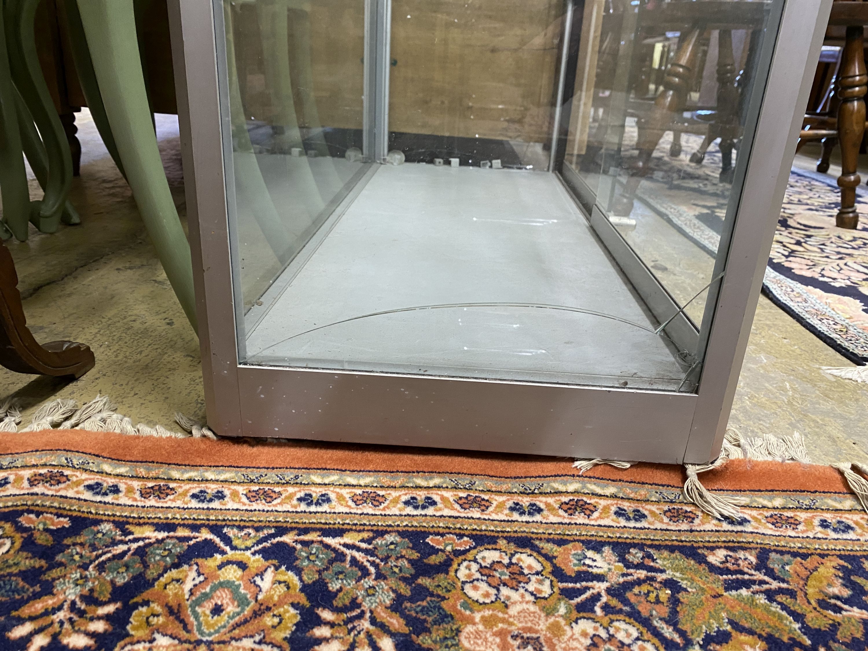 A modern glazed shop cabinet a.f., width 100cm, depth 40cm, height 191cm